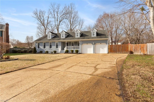 cape cod-style house featuring a garage, covered porch, and a front lawn