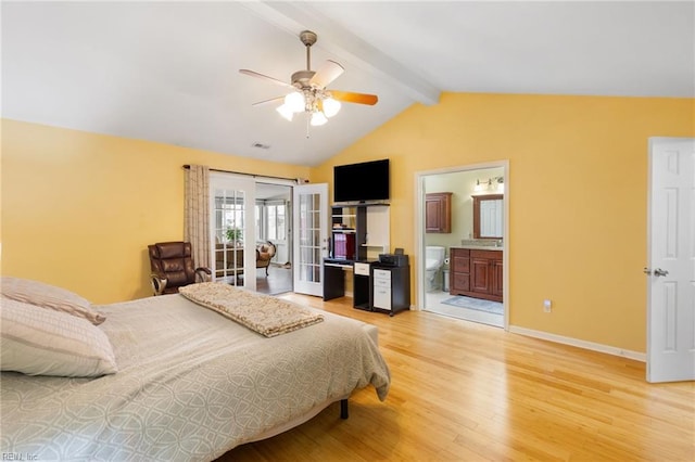 bedroom with lofted ceiling with beams, wood-type flooring, ceiling fan, ensuite bath, and french doors