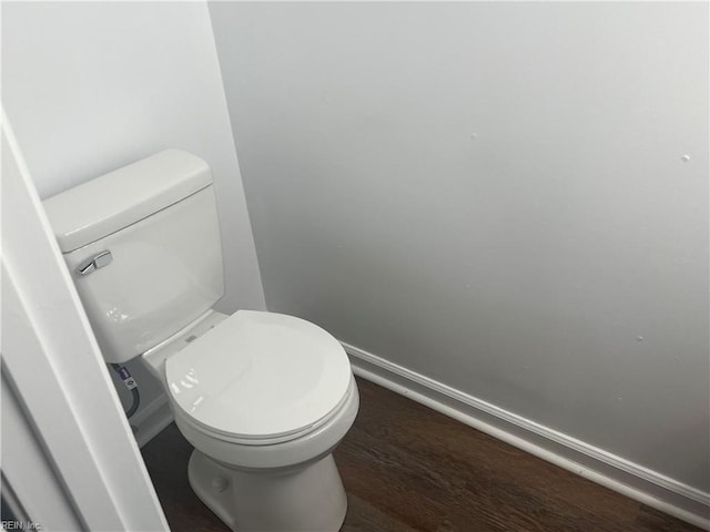 bathroom featuring hardwood / wood-style floors and toilet