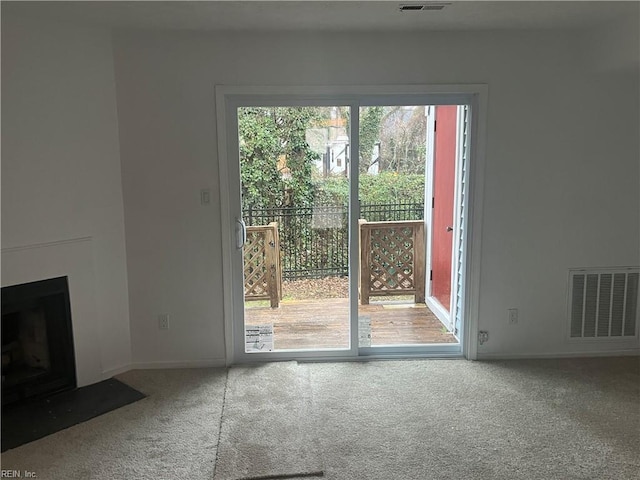 unfurnished living room with carpet flooring