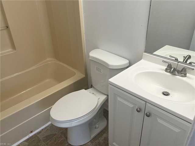 full bathroom featuring vanity, tub / shower combination, and toilet