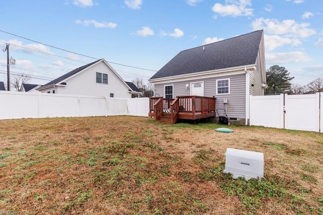 back of house with a yard and a deck