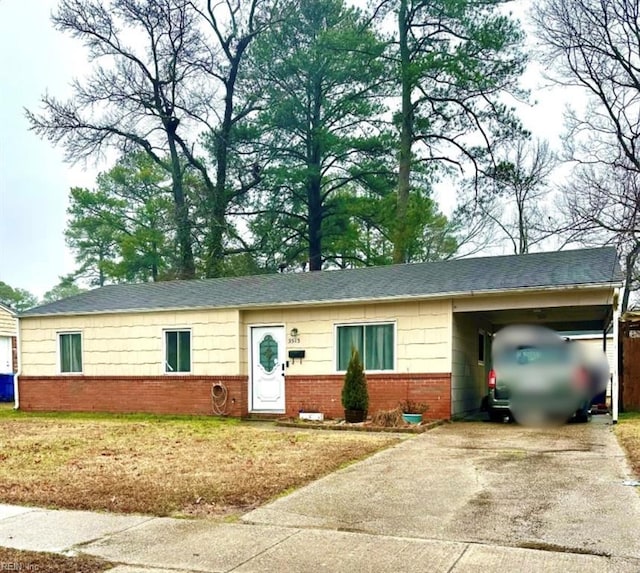 single story home featuring a carport and a front yard