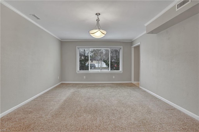 carpeted spare room with ornamental molding