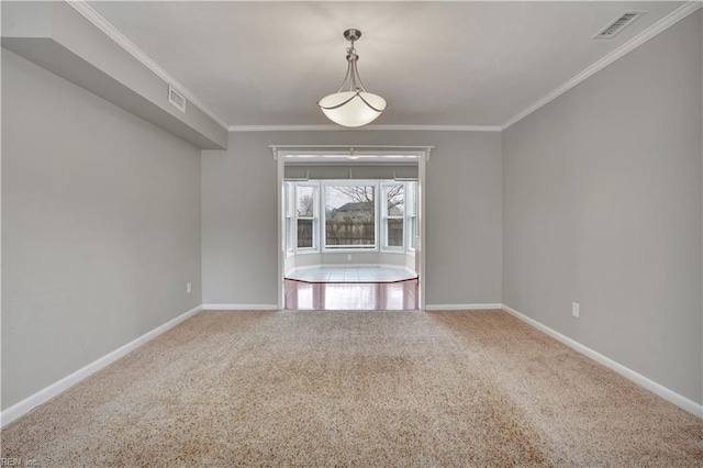 unfurnished dining area with crown molding and carpet floors