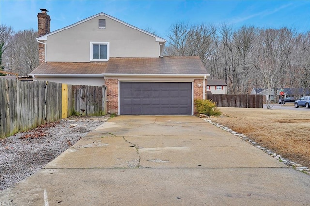 view of side of property featuring a garage