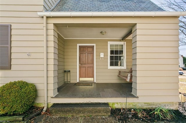 property entrance featuring a porch