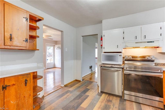 kitchen featuring white cabinetry, stainless steel appliances, and hardwood / wood-style floors