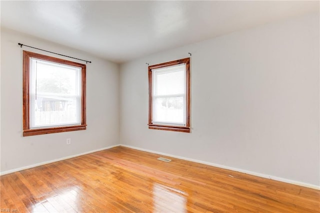 empty room with wood-type flooring