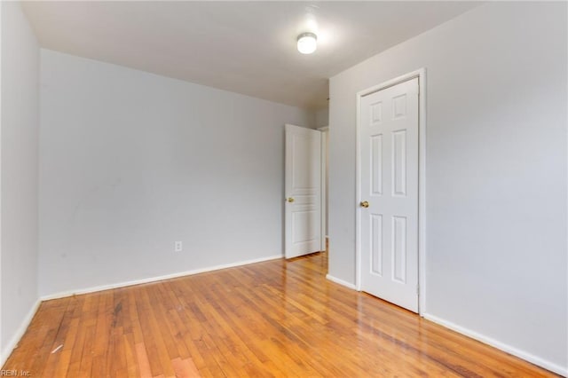 spare room with hardwood / wood-style floors