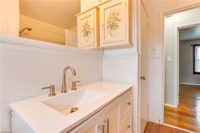 bathroom featuring vanity and hardwood / wood-style floors