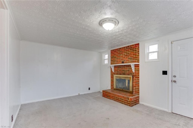 unfurnished living room featuring light colored carpet, a textured ceiling, and a fireplace