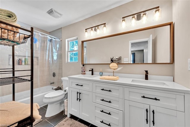 full bathroom featuring tiled shower / bath, vanity, tile patterned floors, and toilet