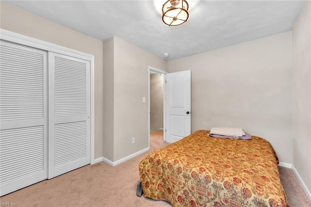 carpeted bedroom featuring a closet