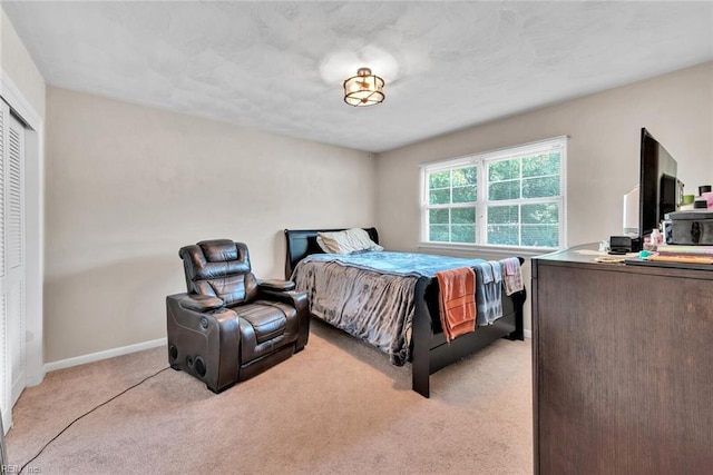 carpeted bedroom with a closet