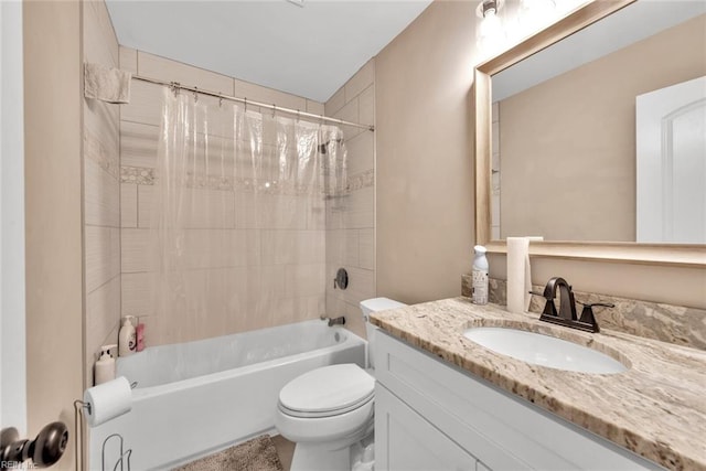 full bathroom with vanity, shower / tub combo with curtain, and toilet