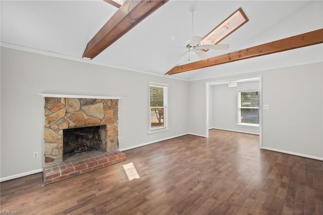 unfurnished living room with ceiling fan, a fireplace, dark hardwood / wood-style flooring, and vaulted ceiling with beams