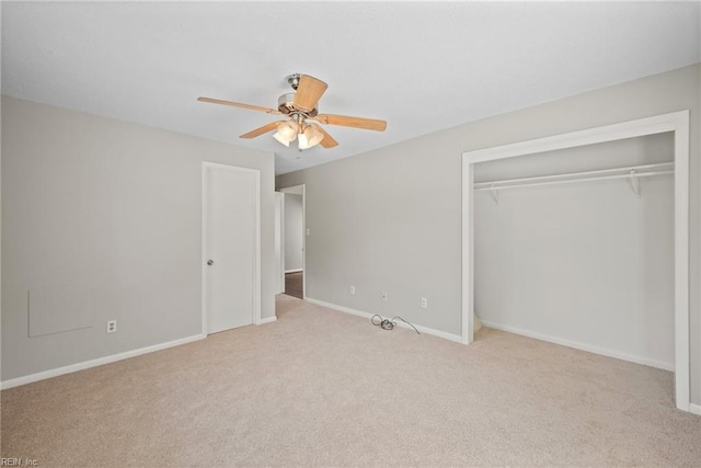 unfurnished bedroom with light carpet, ceiling fan, and a closet