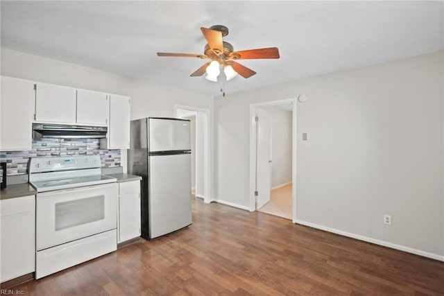 kitchen with stainless steel fridge, white range with electric cooktop, white cabinetry, backsplash, and dark hardwood / wood-style floors