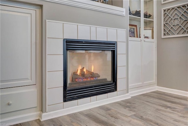 room details featuring hardwood / wood-style floors and a fireplace