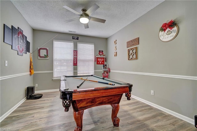 rec room with a textured ceiling, wood-type flooring, billiards, and ceiling fan