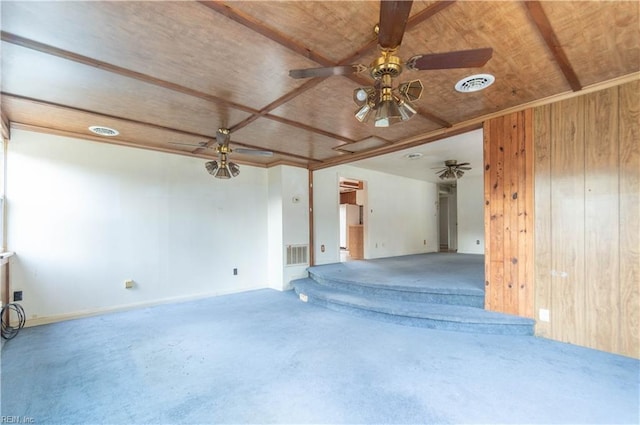 2228 Kings Hwy, Suffolk, VA 23435 - unfurnished room with visible vents, wooden walls, ceiling fan, and carpet