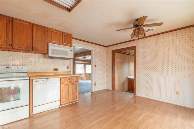 2228 Kings Hwy, Suffolk, VA 23435 - kitchen with light wood-type flooring, white appliances, crown molding, and wallpapered walls