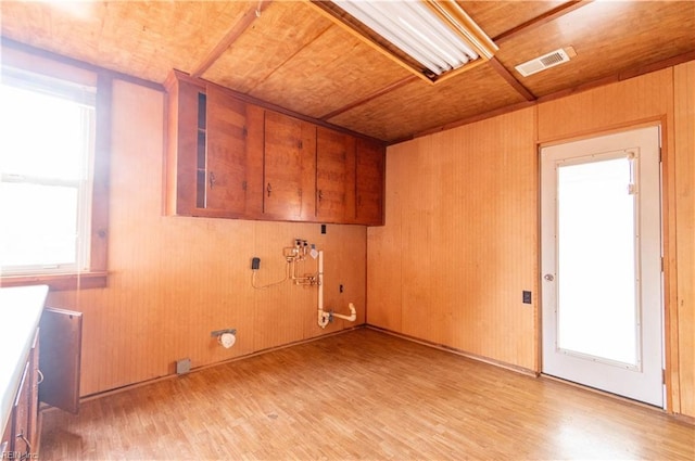 2228 Kings Hwy, Suffolk, VA 23435 - washroom featuring light wood-style flooring, cabinet space, visible vents, and a healthy amount of sunlight
