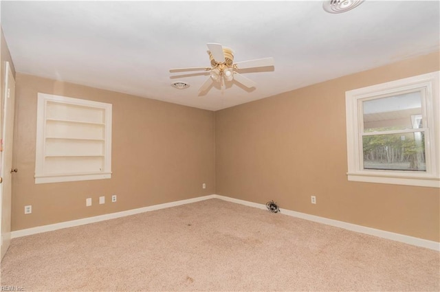 2228 Kings Hwy, Suffolk, VA 23435 - unfurnished room featuring built in features, baseboards, carpet floors, and ceiling fan