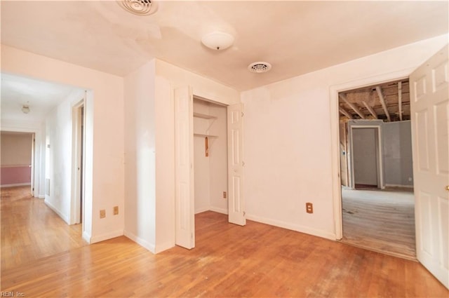 2228 Kings Hwy, Suffolk, VA 23435 - unfurnished bedroom featuring visible vents, light wood-type flooring, and baseboards