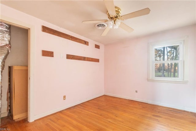 2228 Kings Hwy, Suffolk, VA 23435 - empty room featuring visible vents, baseboards, light wood-style floors, and a ceiling fan