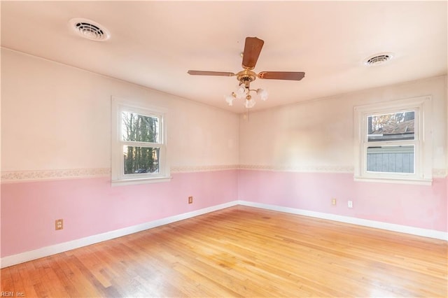 2228 Kings Hwy, Suffolk, VA 23435 - spare room with light wood-type flooring, visible vents, and a healthy amount of sunlight