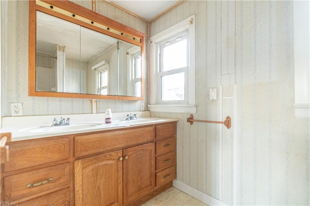 2228 Kings Hwy, Suffolk, VA 23435 - full bathroom with a sink, double vanity, tile patterned floors, and wallpapered walls