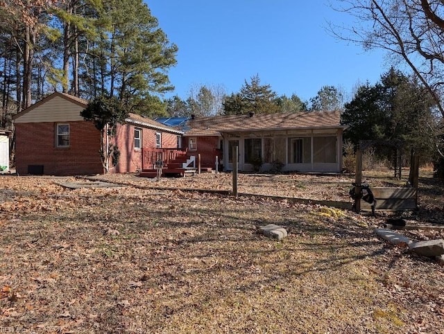 2228 Kings Hwy, Suffolk, VA 23435 - view of front of property featuring brick siding, a deck, and a sunroom