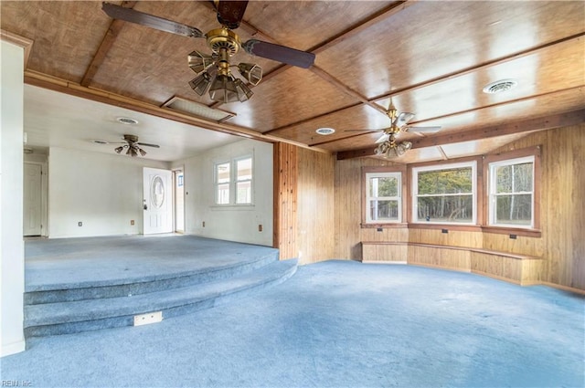 2228 Kings Hwy, Suffolk, VA 23435 - carpeted empty room featuring visible vents, wooden walls, ceiling fan, and wooden ceiling