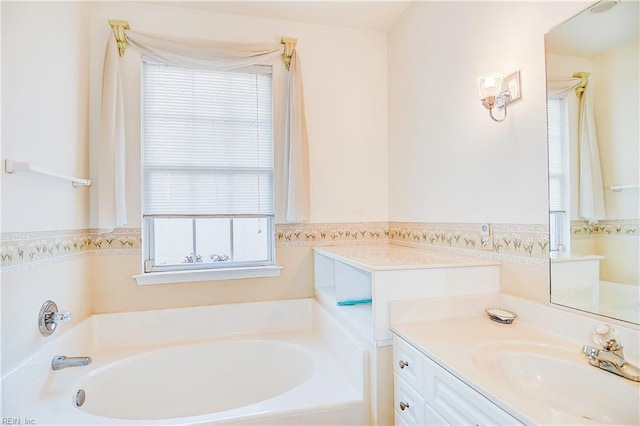 bathroom with vanity and a tub to relax in