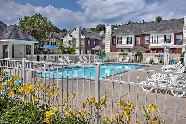 view of swimming pool featuring a patio area