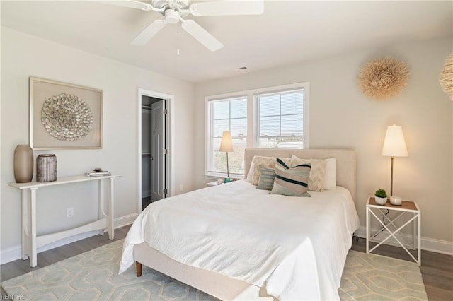 bedroom with ceiling fan and hardwood / wood-style floors