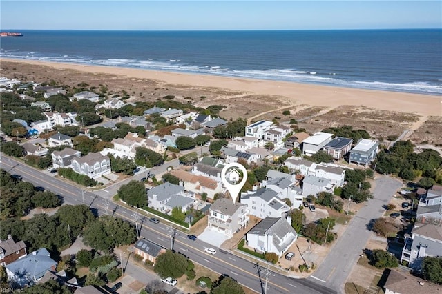 bird's eye view featuring a beach view and a water view