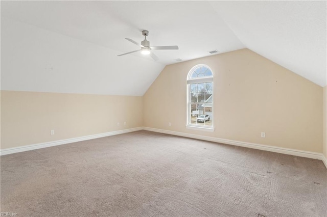 bonus room featuring carpet, lofted ceiling, and ceiling fan