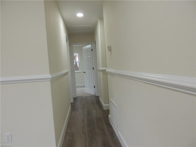 hallway featuring dark hardwood / wood-style floors