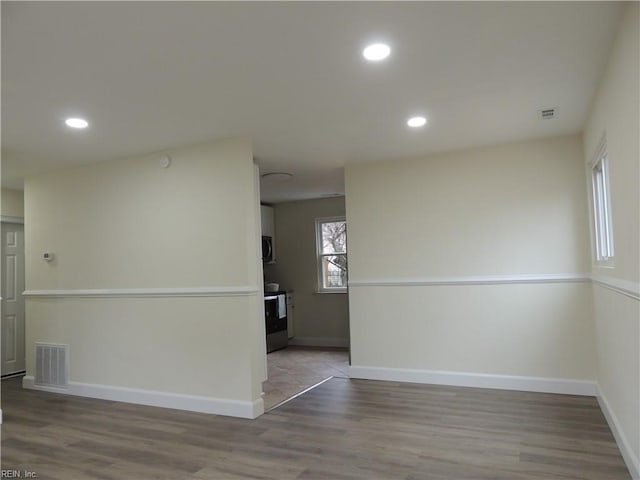 spare room with light hardwood / wood-style flooring