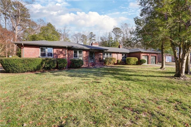 single story home featuring a garage and a front yard