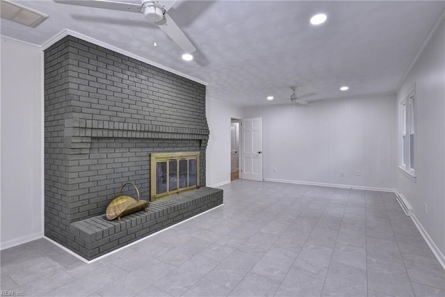 unfurnished living room featuring crown molding, a fireplace, and ceiling fan