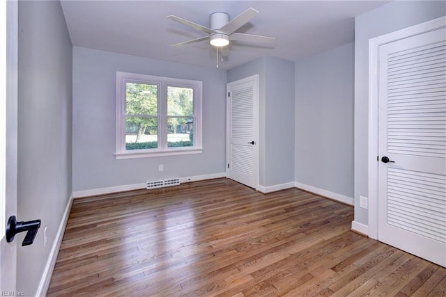 unfurnished bedroom with hardwood / wood-style flooring and ceiling fan