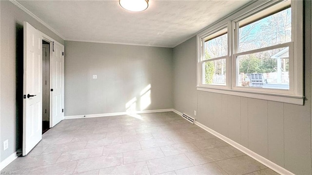 spare room featuring ornamental molding