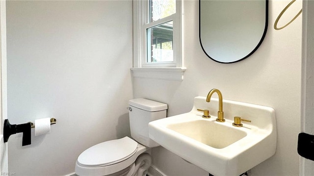 bathroom with sink and toilet