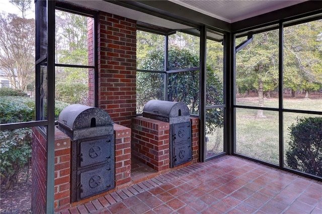 unfurnished sunroom with plenty of natural light