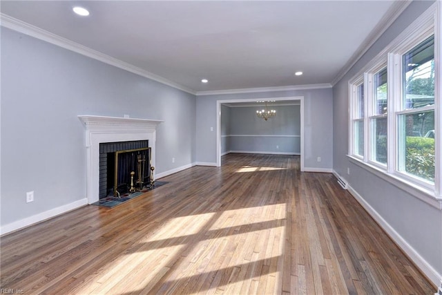 unfurnished living room featuring ornamental molding, a fireplace, and hardwood / wood-style floors