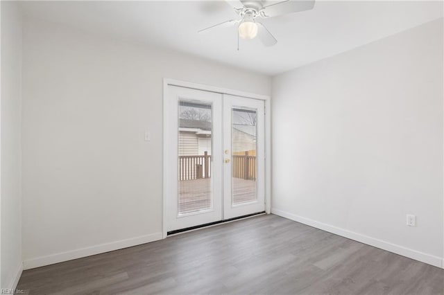 unfurnished room with wood-type flooring, french doors, and ceiling fan